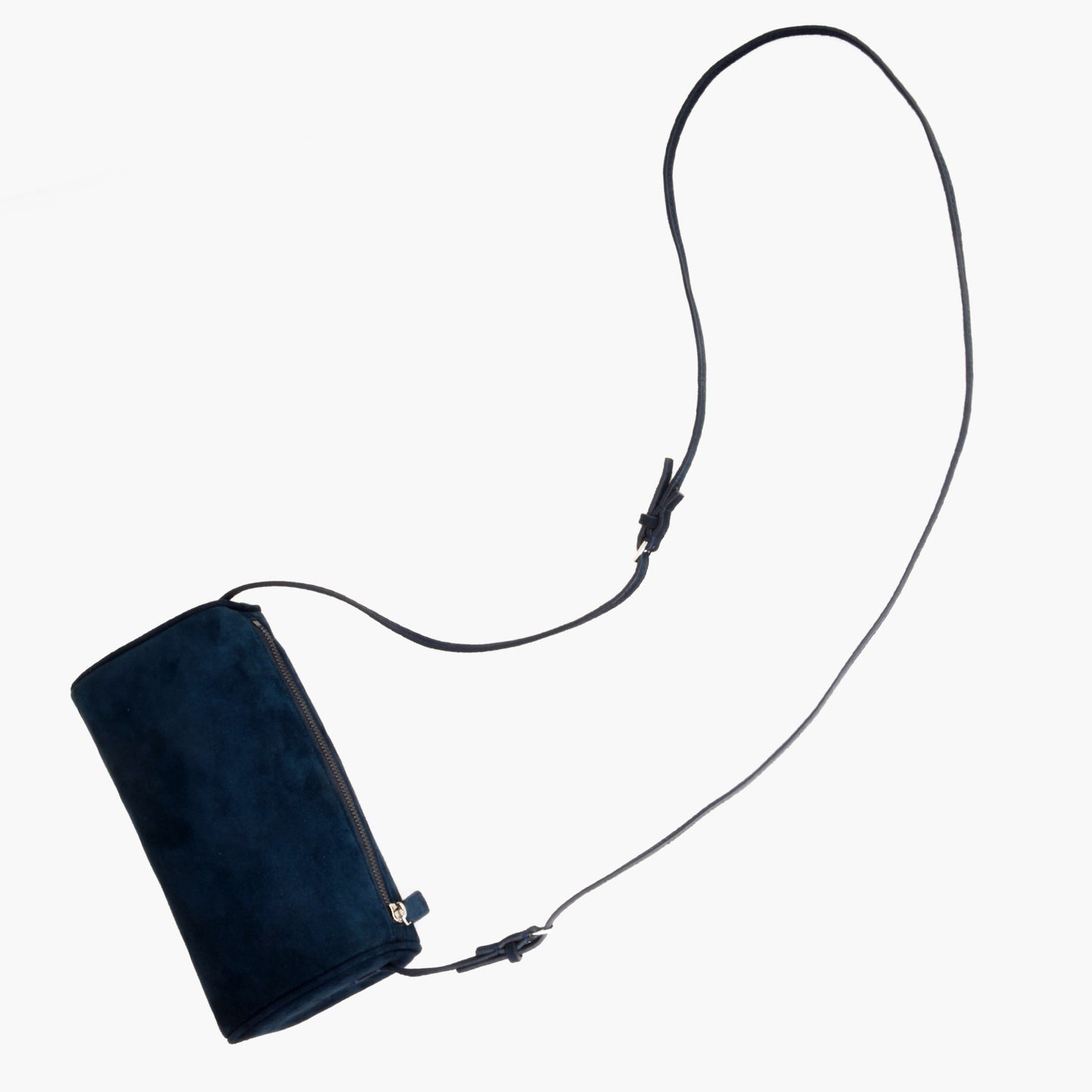 Minimalist women's suede handbag with adjustable shoulder strap