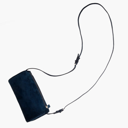 Minimalist women's suede handbag with adjustable shoulder strap